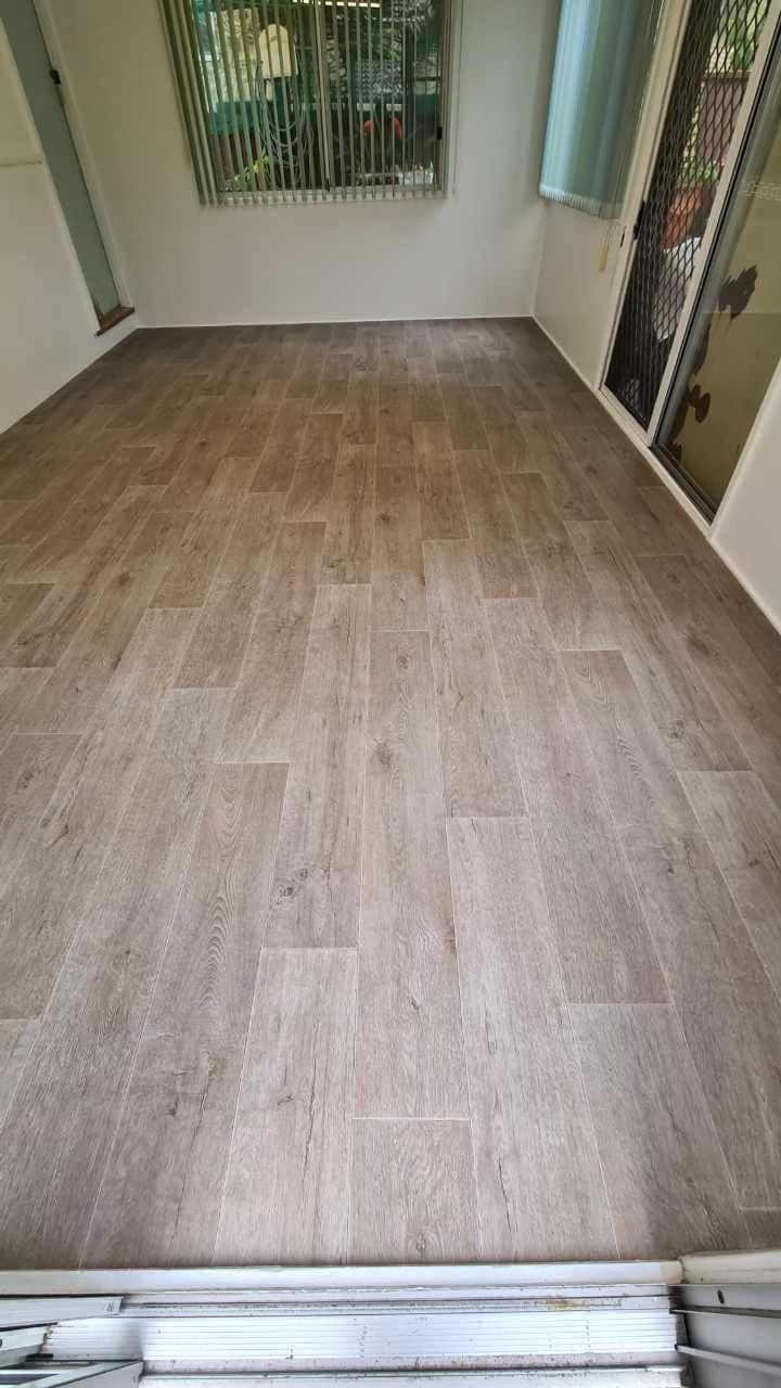 A Room With A Wooden Floor And A Window — Charmhaven Carpets In Charmhaven, NSW