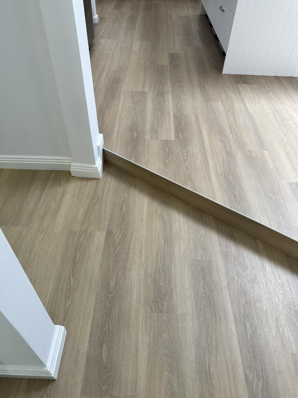 A Wooden Floor With a Mirror on It in a Room — Charmhaven Carpets in Central Coast, NSW