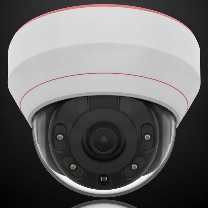 Dome security camera with white housing and black lens on a gray background