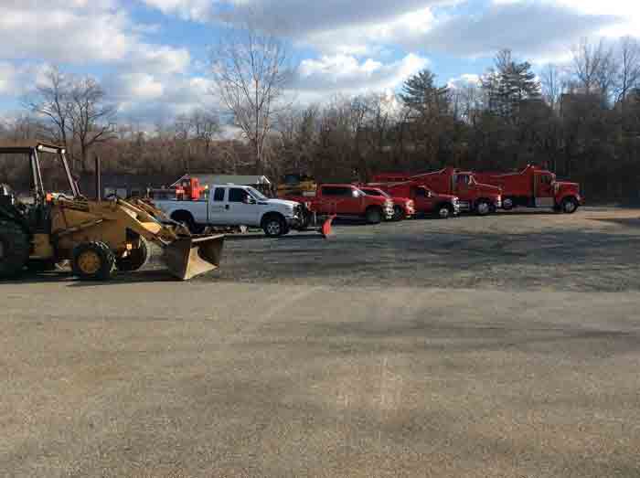 Asphalted Road With Trucks — Baltimore, MD —  E Cooper Contracting