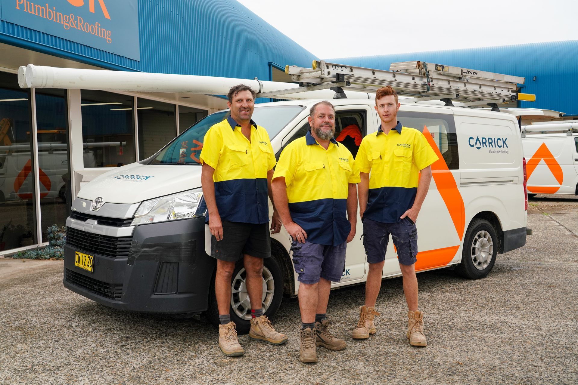 Our team of Roofers in Port Macquarie in front of Carrick Plumbing & Roofing van