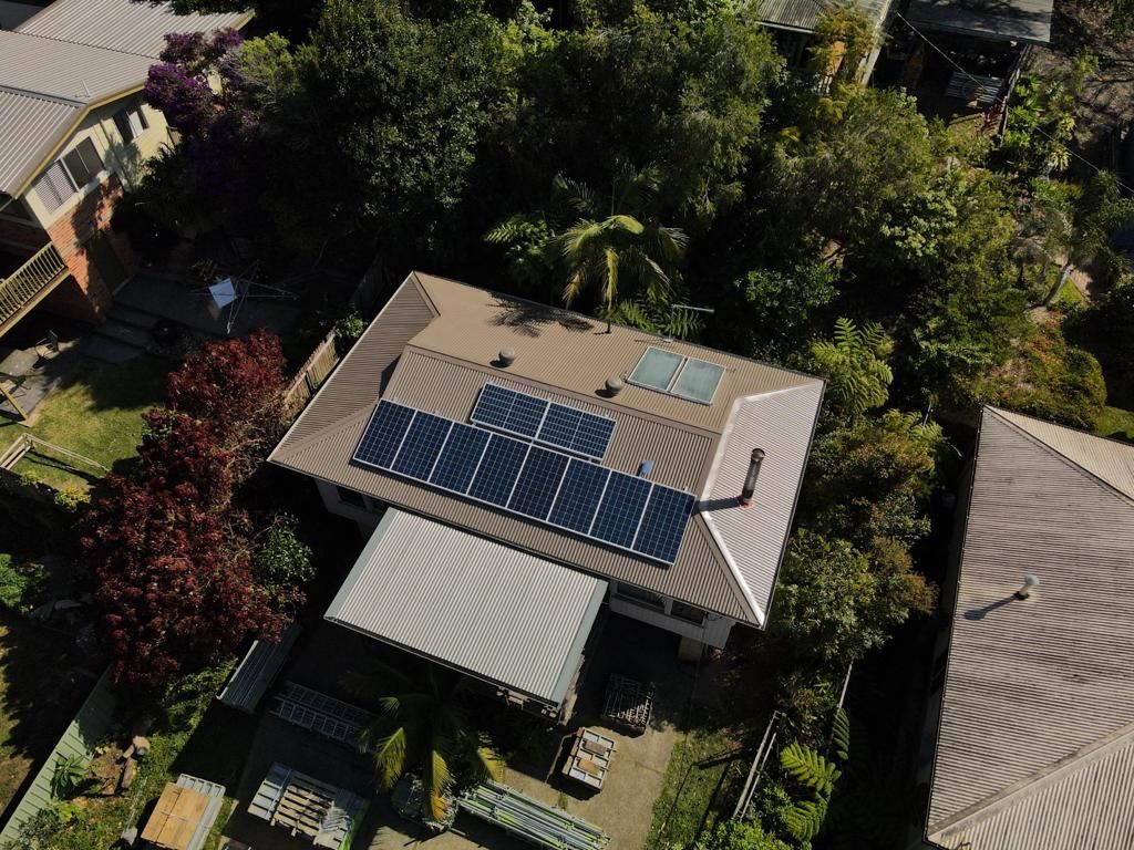 Tile to Metal Roof Replacements photo of a house roof