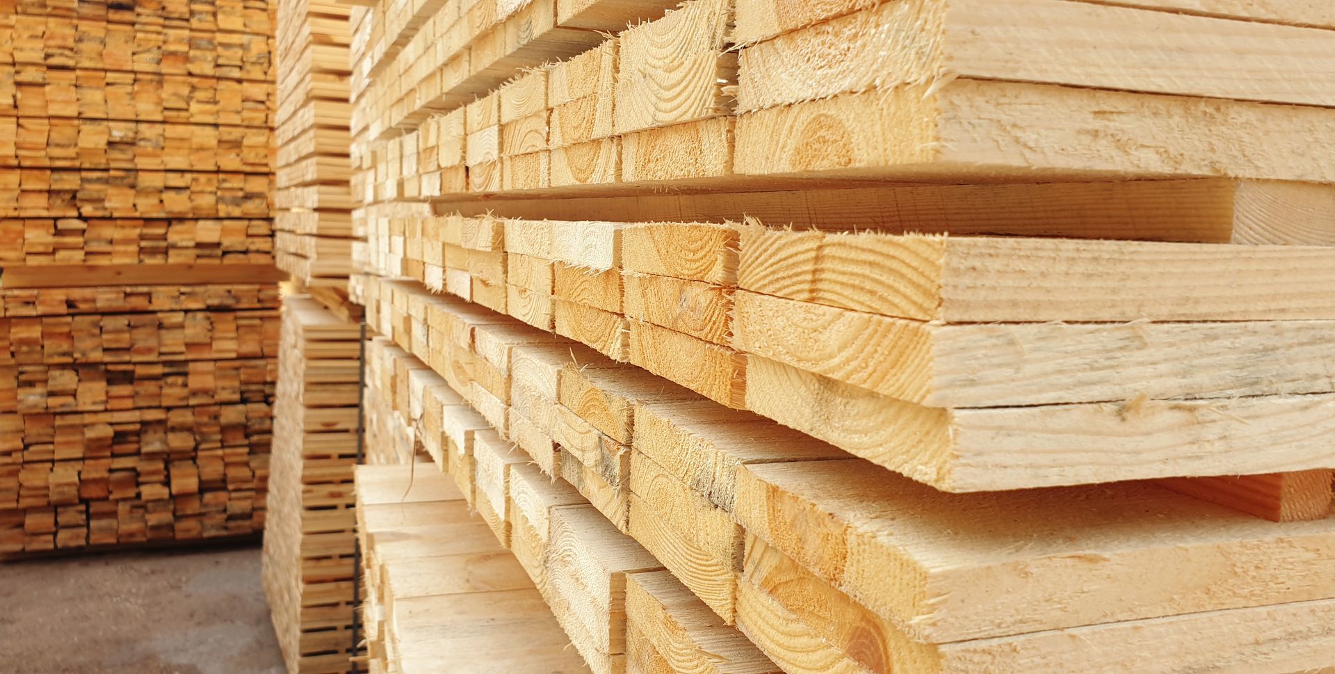 Stacks of freshly cut lumber, ready for construction.