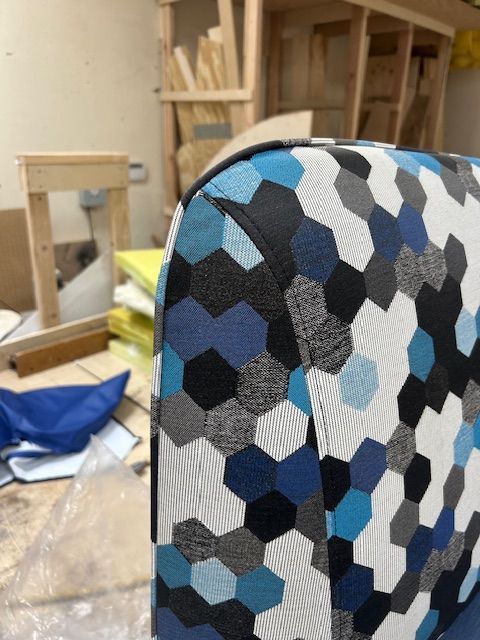 A chair with a blue and white pattern on it