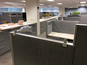 There are a lot of cubicles in this office.