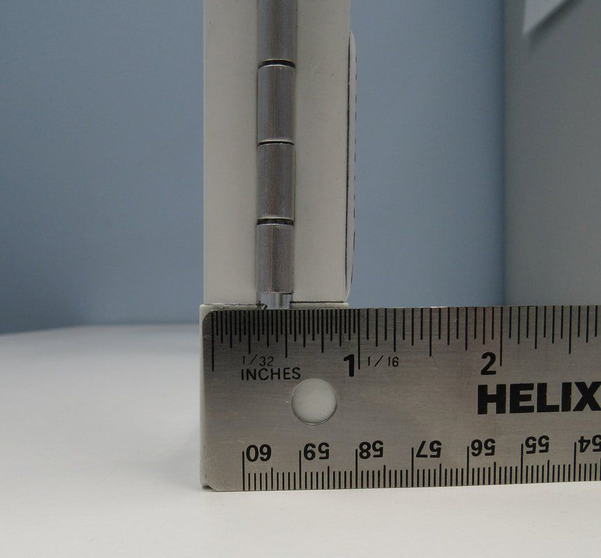 A metal ruler with the word helix on it