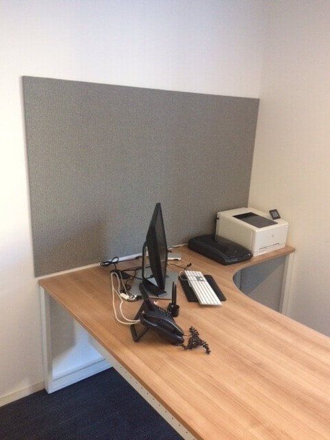 A desk with a computer and a printer on it