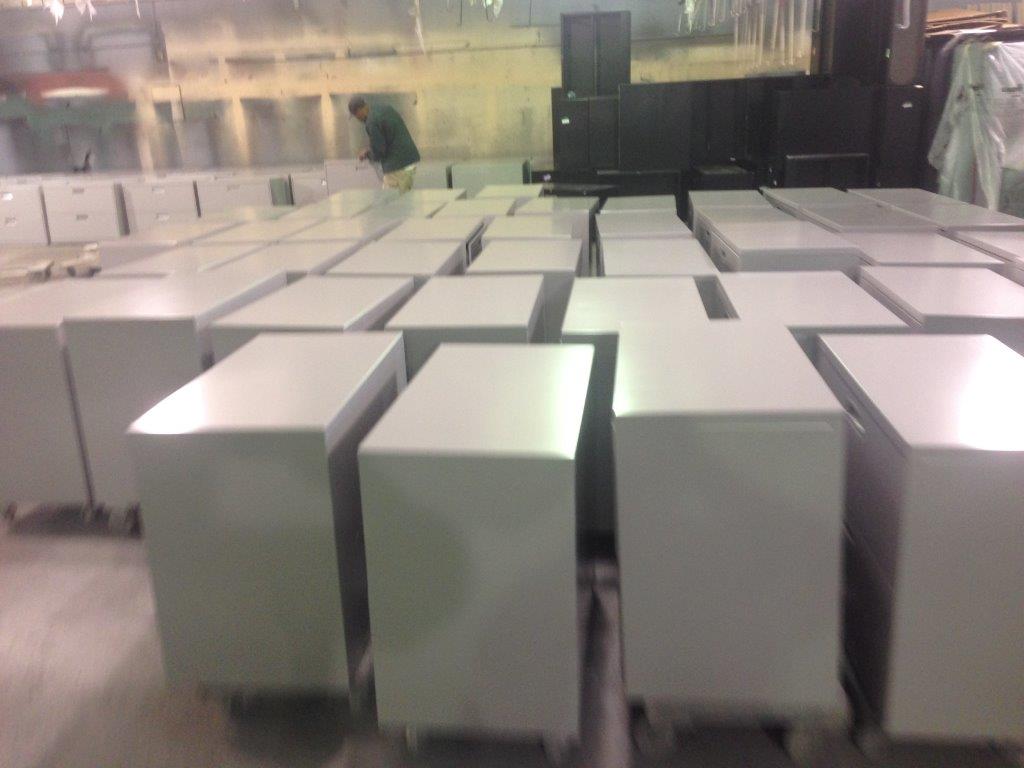 A warehouse filled with lots of white boxes on wheels