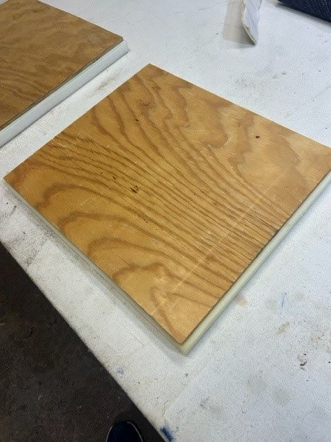 A piece of wood is sitting on a white table