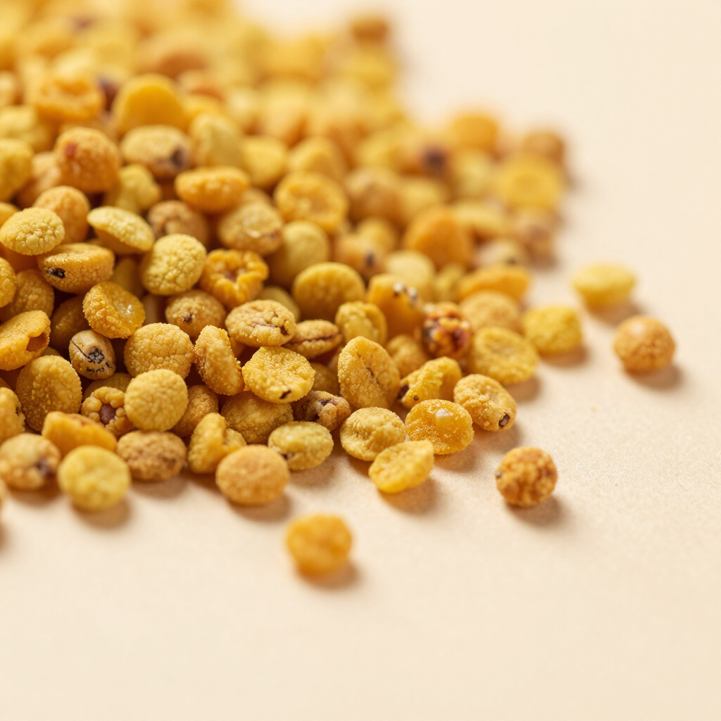 Golden bee pollen granules close-up
