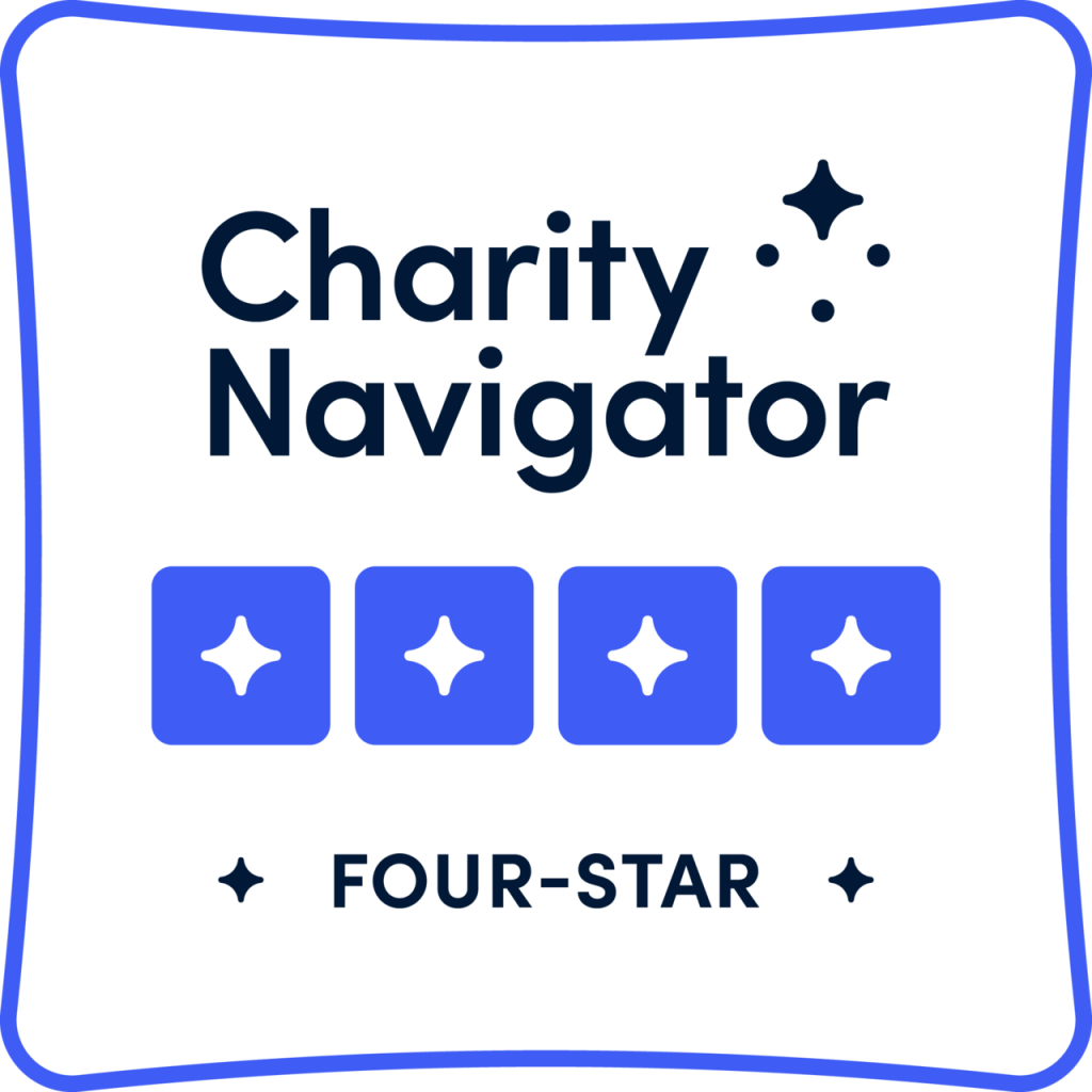 Charity Navigator four-star rating badge with blue stars on a white background