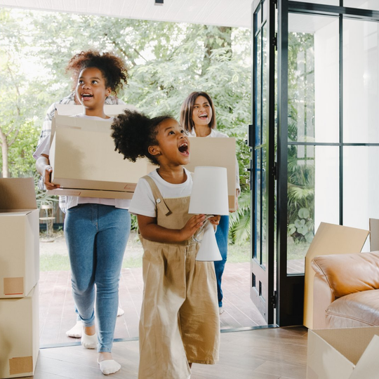 happy family moving into new home