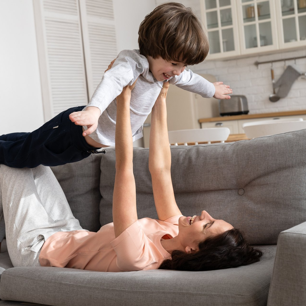 Happy mom and son in new home