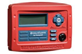 A red fire alarm annunciator with blue buttons on a white background.