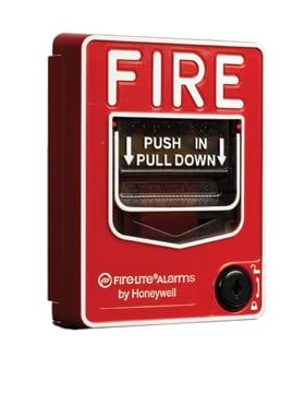 A red fire alarm with the words fire push in pull down on it.