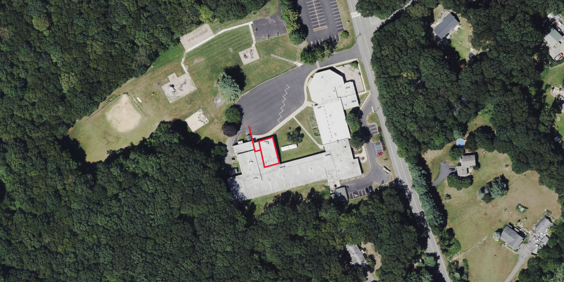 Overhead view of Old Farmers Road School showing where the gym is located in school