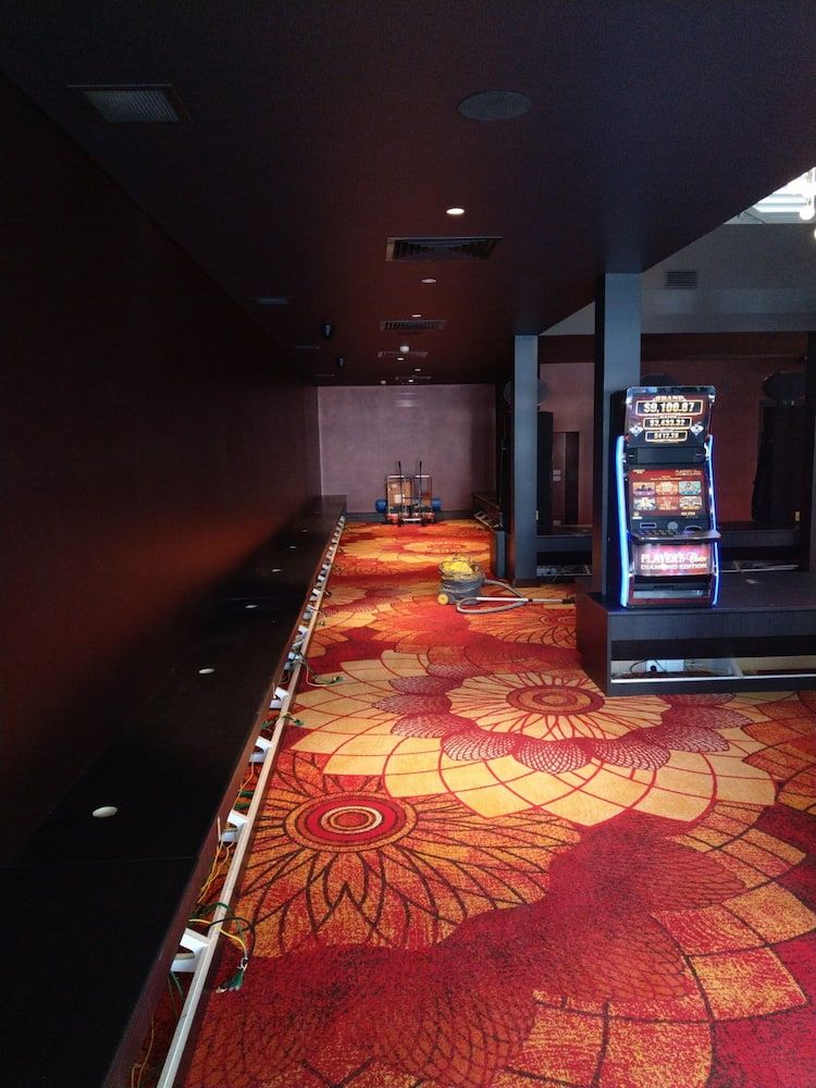 An Empty Hallway With a Slot Machine in the Corner — Shields Painting & Decorating in Gundagai, NSW
