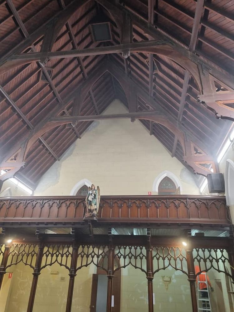 The Inside of a Church With a Wooden Balcony and a Wooden Ceiling — Shields Painting & Decorating in Wagga Wagga, NSW