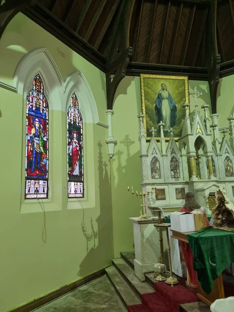 A Church With Stained Glass Windows and a Painting on the Wall — Shields Painting & Decorating in Wagga Wagga, NSW