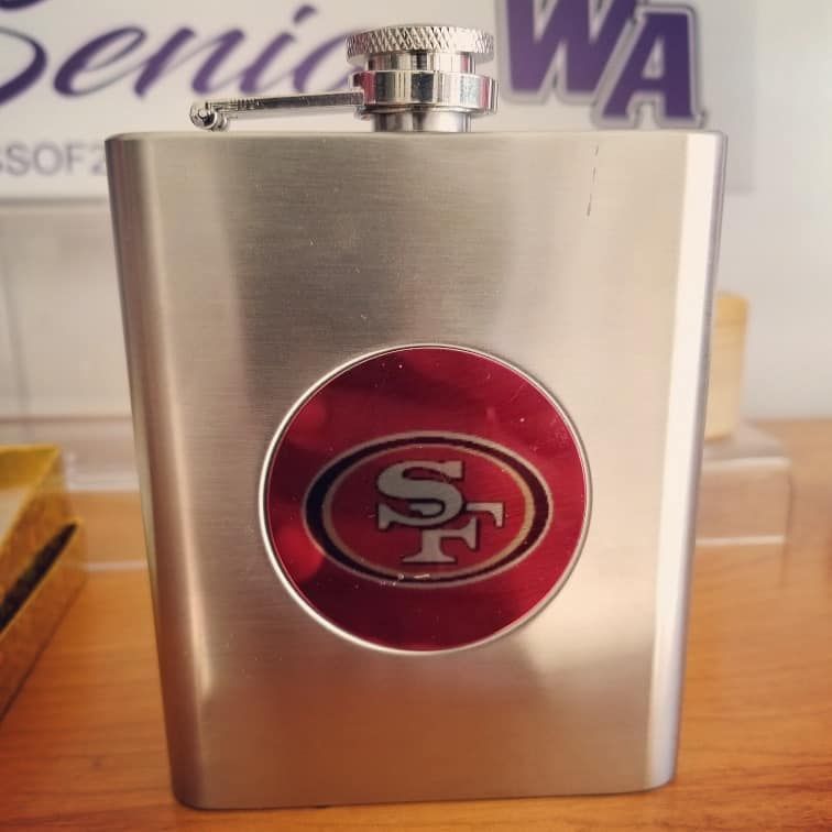 A flask with the san francisco 49ers logo on it