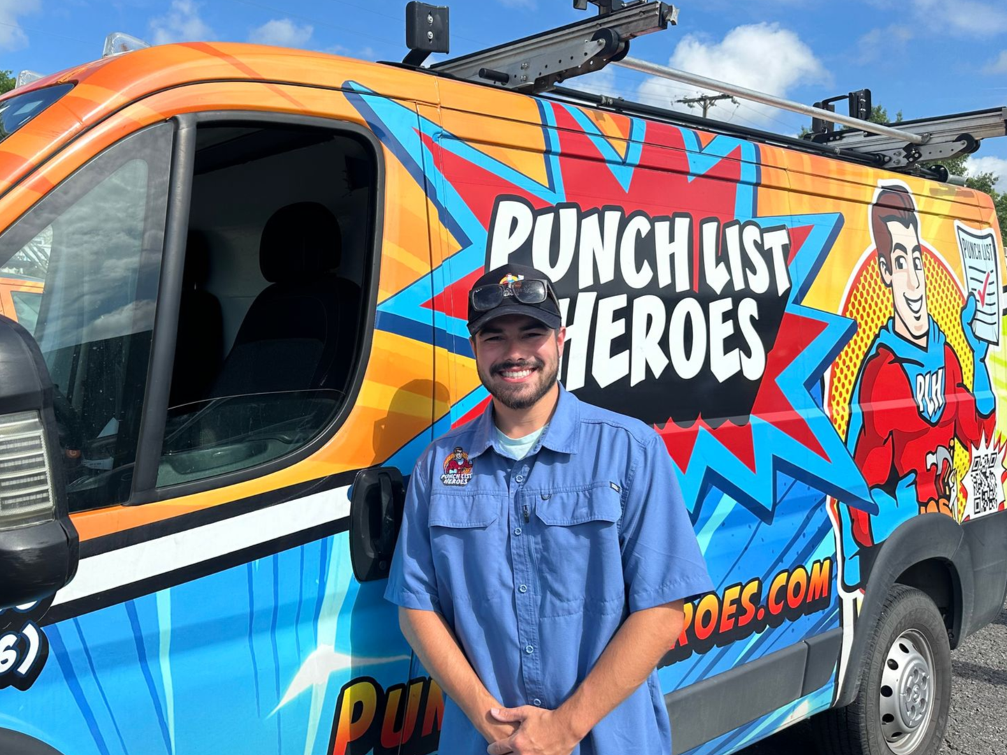 A young man is standing in front of a colorful van. A young man is standing in front of a colorful van.