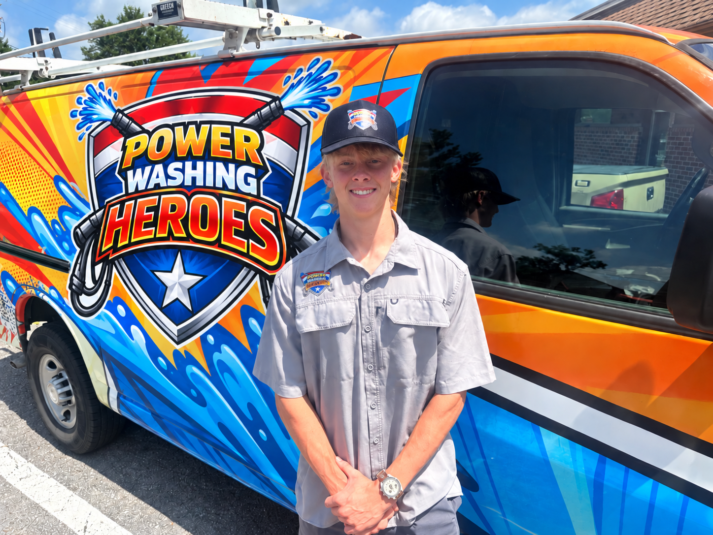 A young man is standing in front of a colorful van. A young man is standing in front of a colorful van.