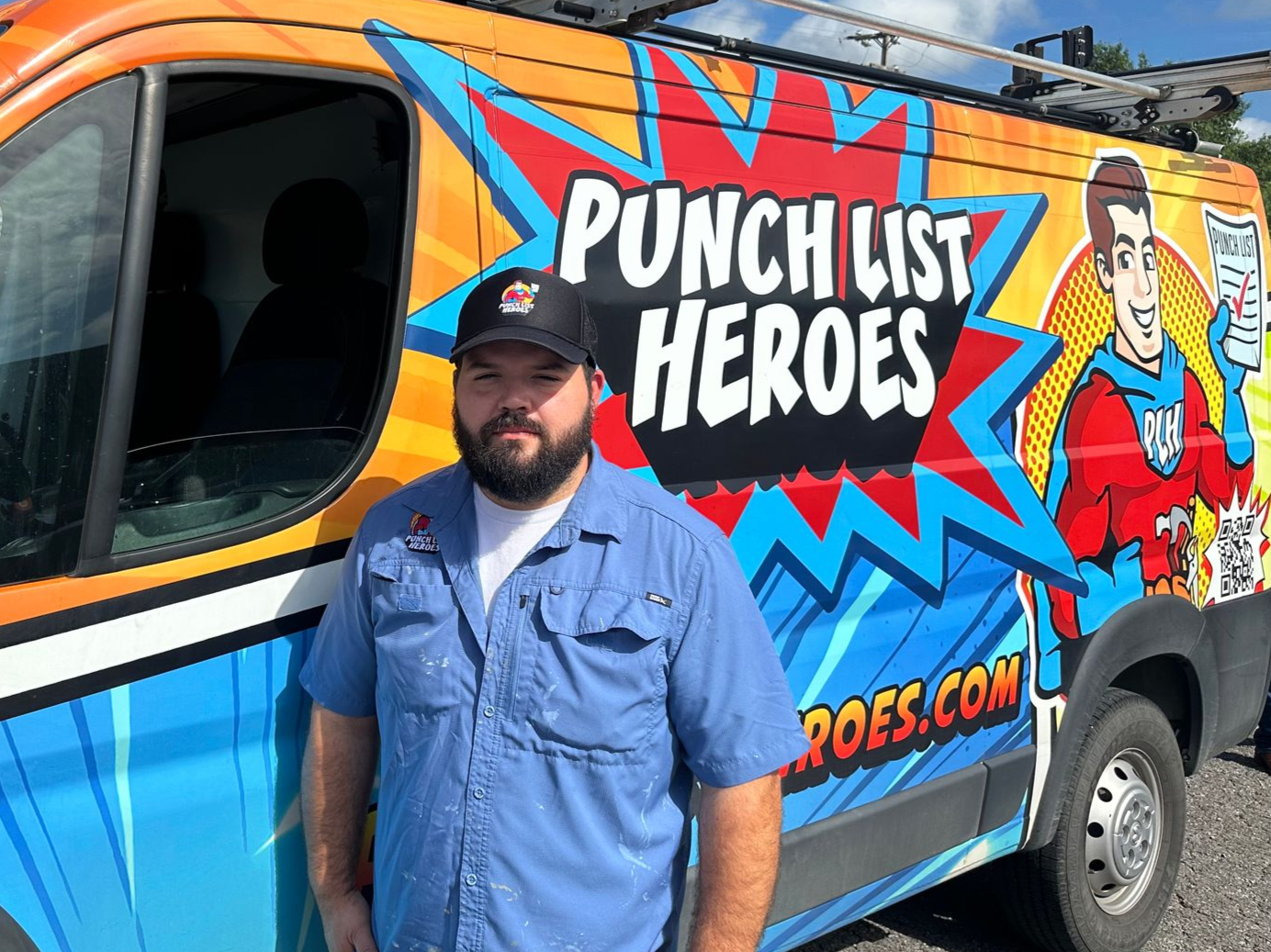 A young man is standing in front of a colorful van. A young man is standing in front of a colorful van.
