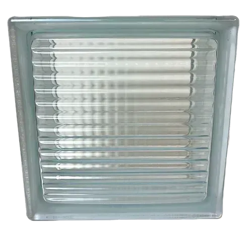 Clear glass block window with horizontal ridges and frosted edges