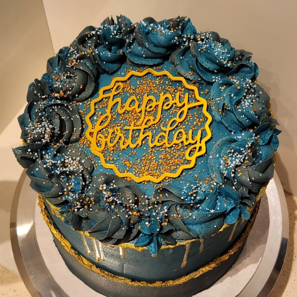 Teal birthday cake with gold trim and 
