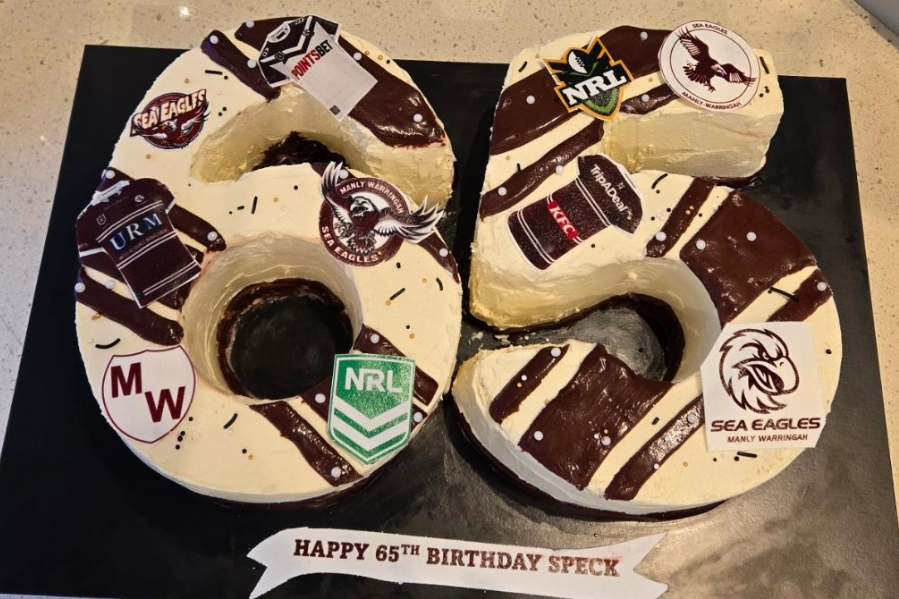 Cake shaped as the numbers 65, decorated with rugby logos 