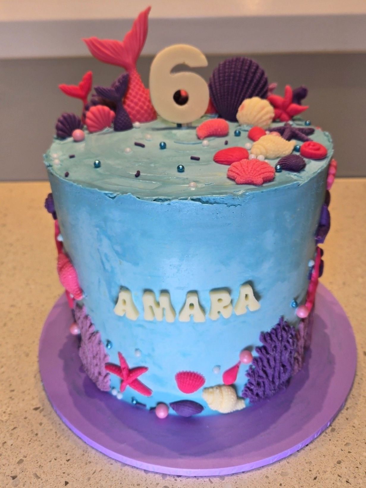 Blue mermaid-themed cake with 