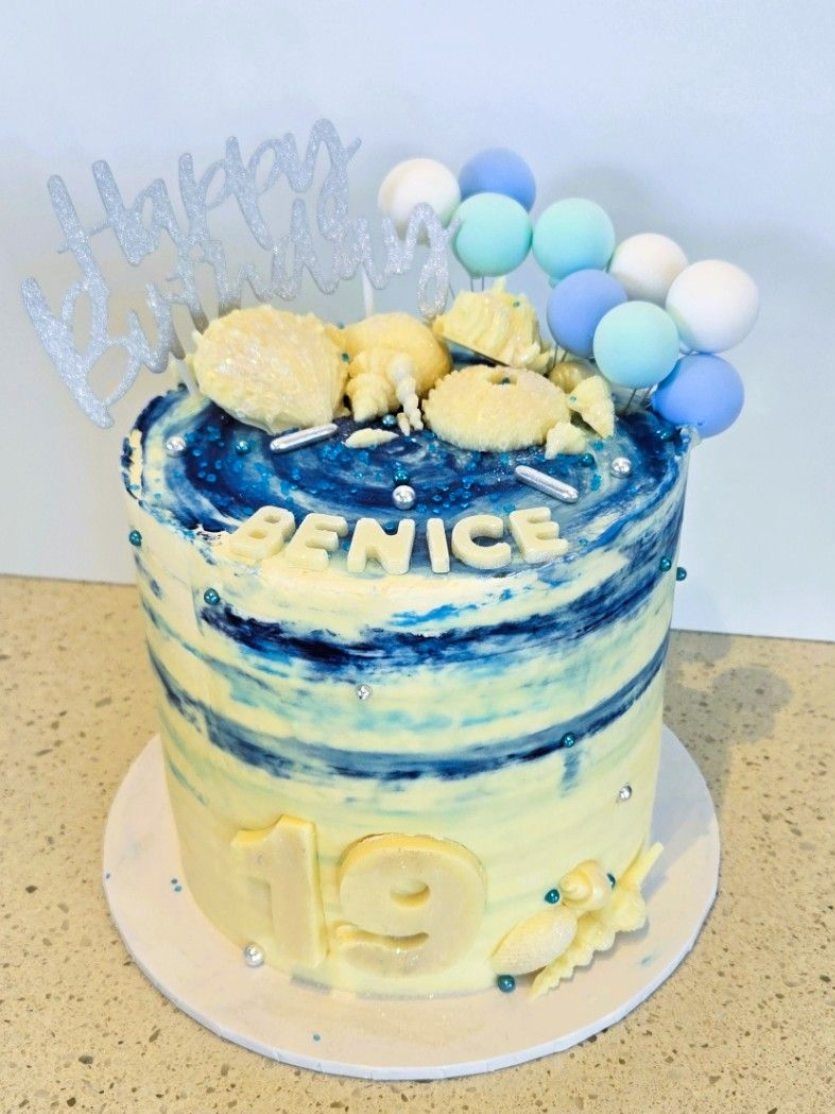 Cake decorated with blue and white frosting, 