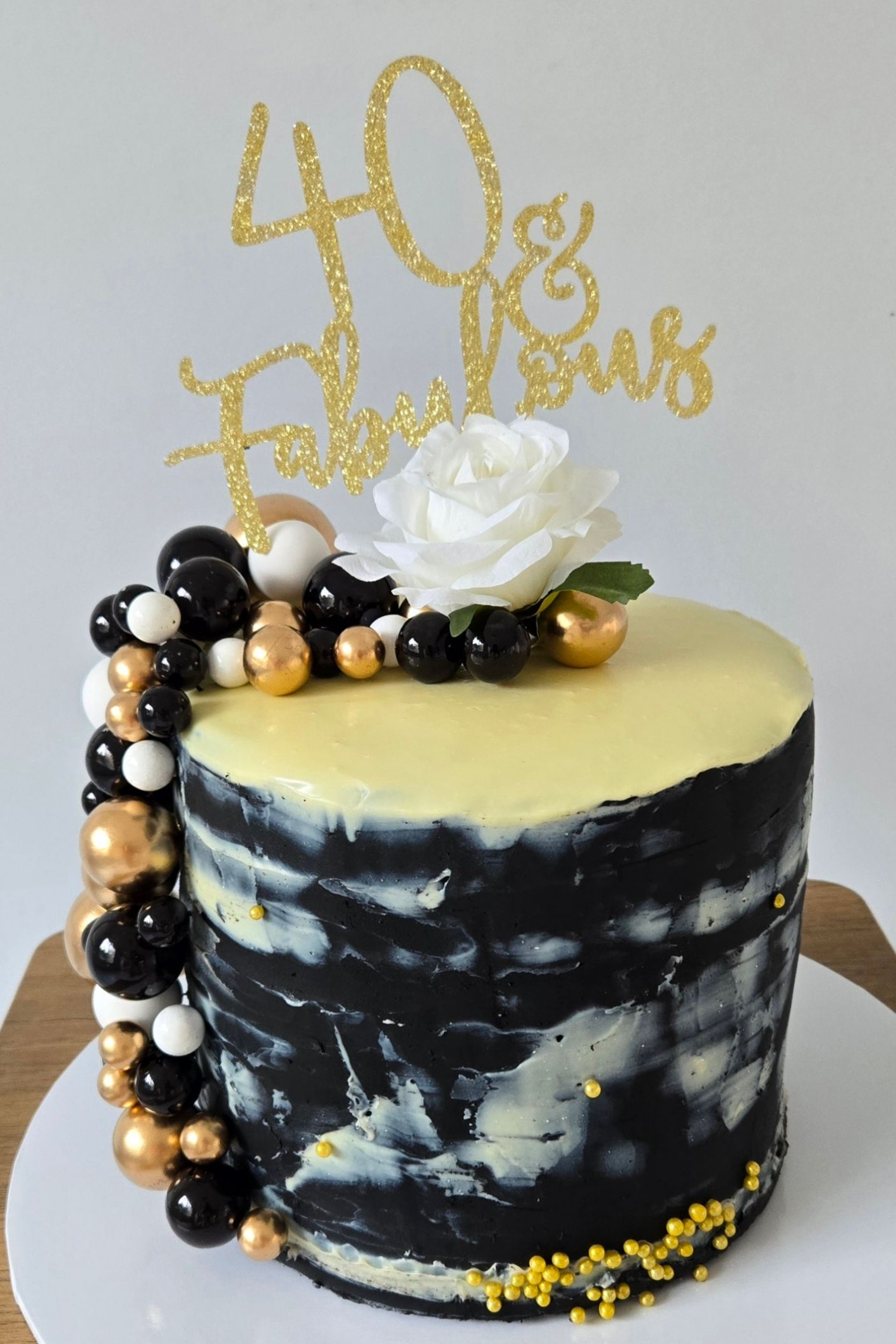 Cake decorated with blue and white frosting and 