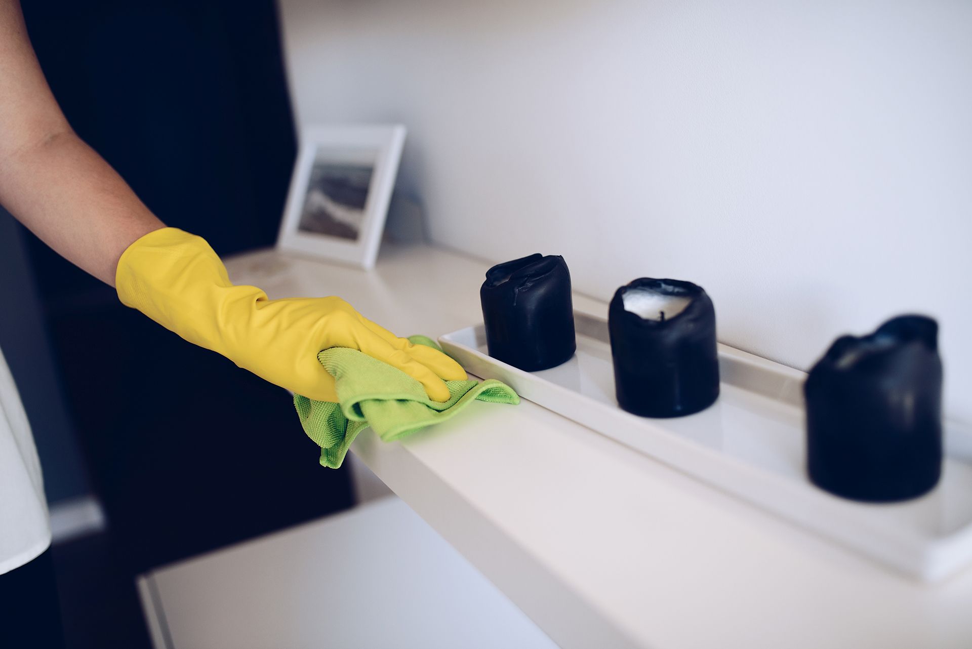 Cleaning a Shelf with A Cloth