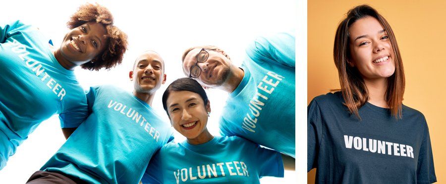 A group of people wearing volunteer shirts are standing next to each other.