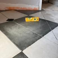 Natural stone flooring installed in a premium entryway with elegant veining.