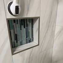 Precision tile installation with clean grout lines in a modern home interior.