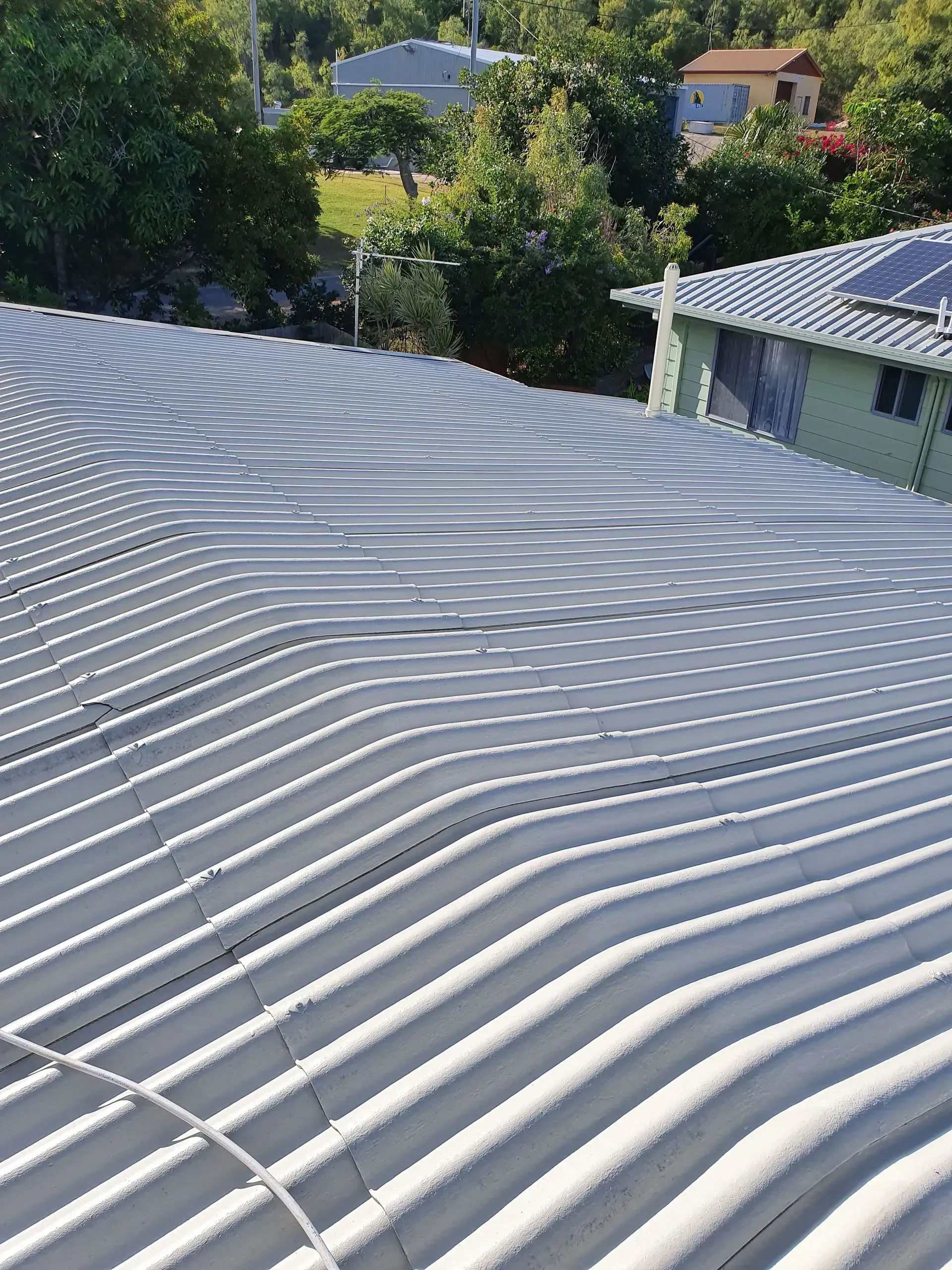 Corrugated Metal Roof, Gray, Wavy Lines — Keppel Coatings in Pacific Heights, QLD