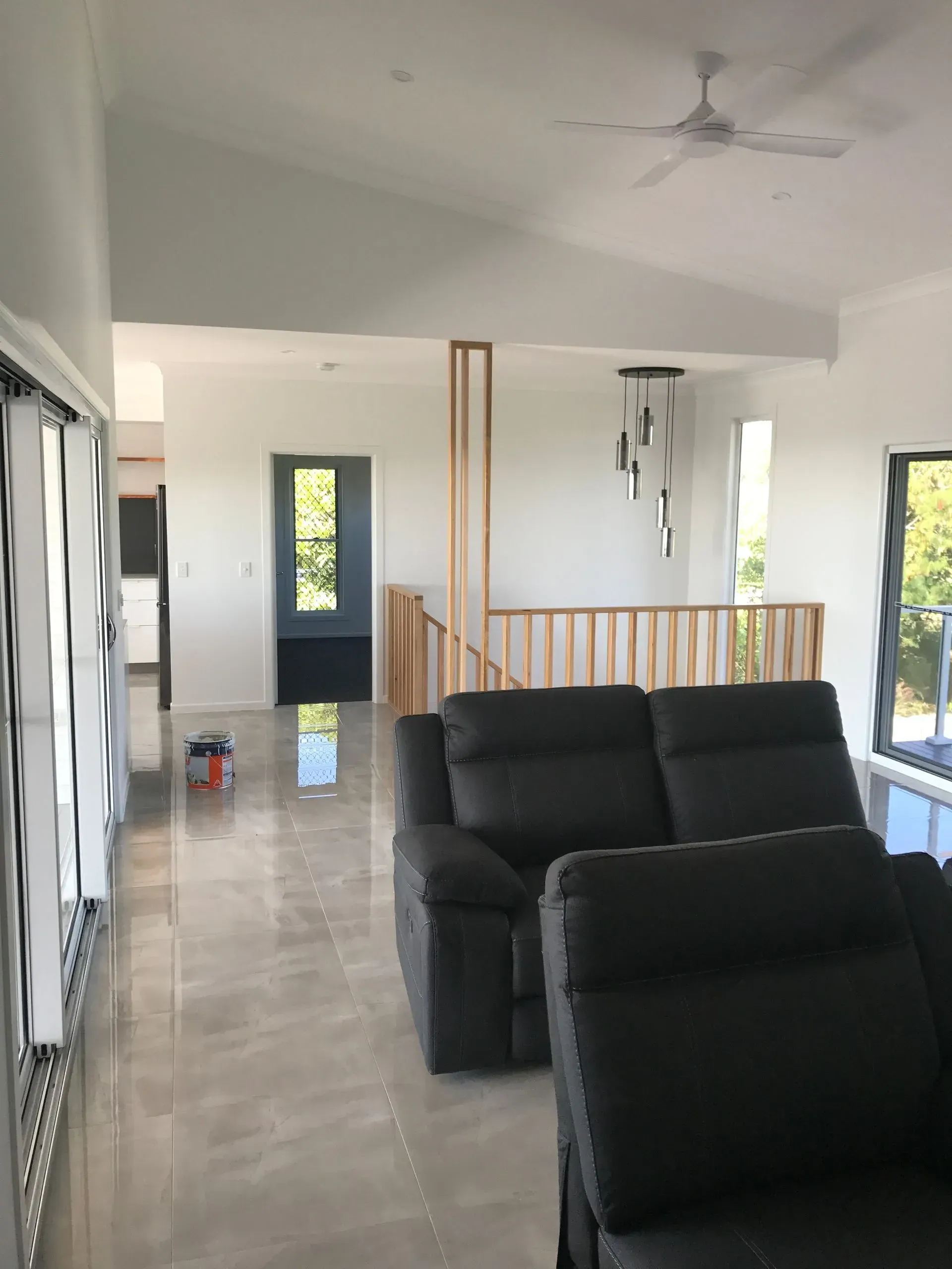 Spacious Living Room With Gray Leather Sofa — Keppel Coatings in Pacific Heights, QLD
