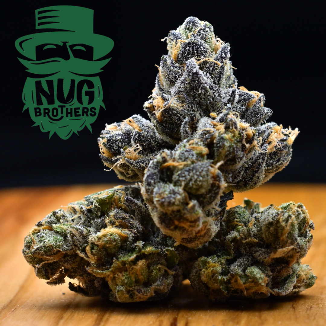 Cannabis buds stacked on a black and orange background with a green “Nug Brothers” logo