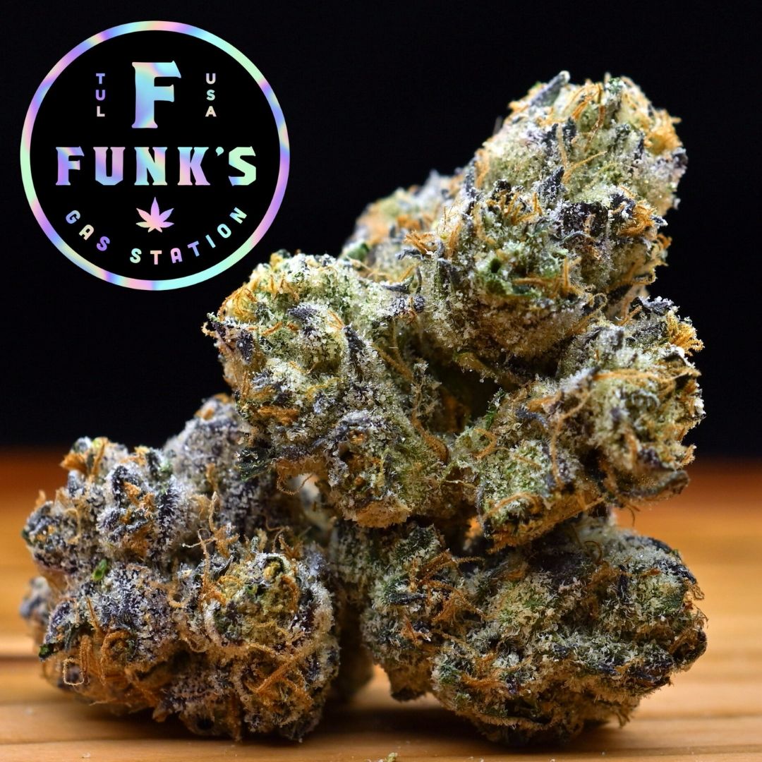 Cannabis buds on wood surface with a Funk’s logo in the corner
