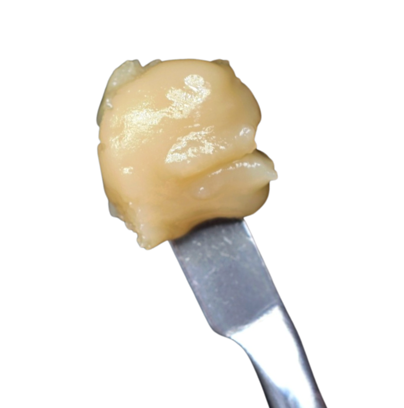 A beige dollop of food on a metal fork against a white background