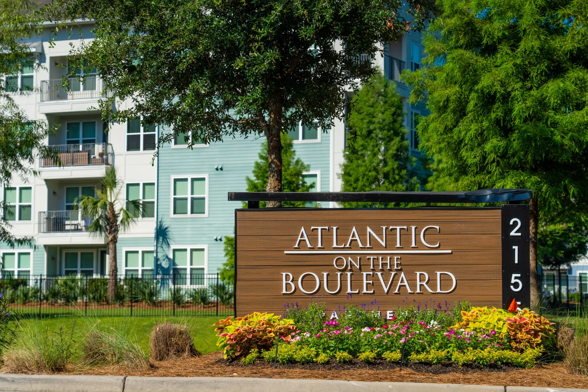 Atlantic on the Boulevard monument sign and apartment building exterior at Atlantic on the Boulevard in North Charleston, SC.