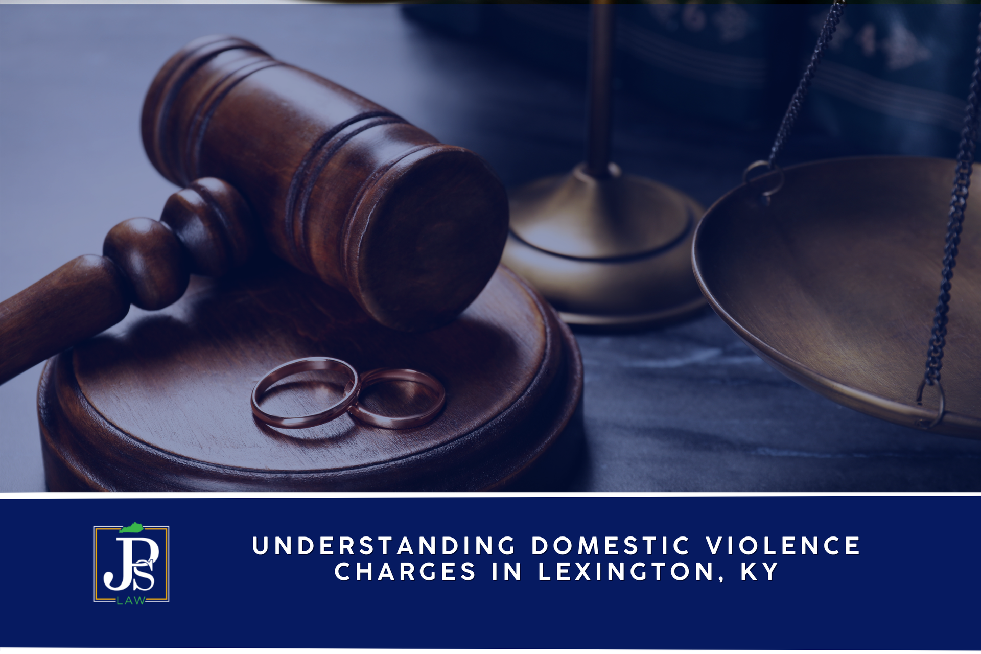 A gavel and wedding rings on a courtroom bench, representing domestic violence charges in Kentucky