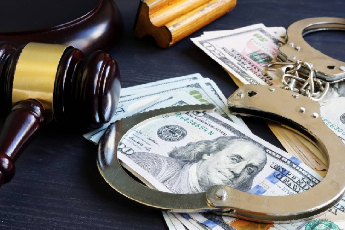 A gavel, money, and handcuffs near Lexington, Kentucky (KY)