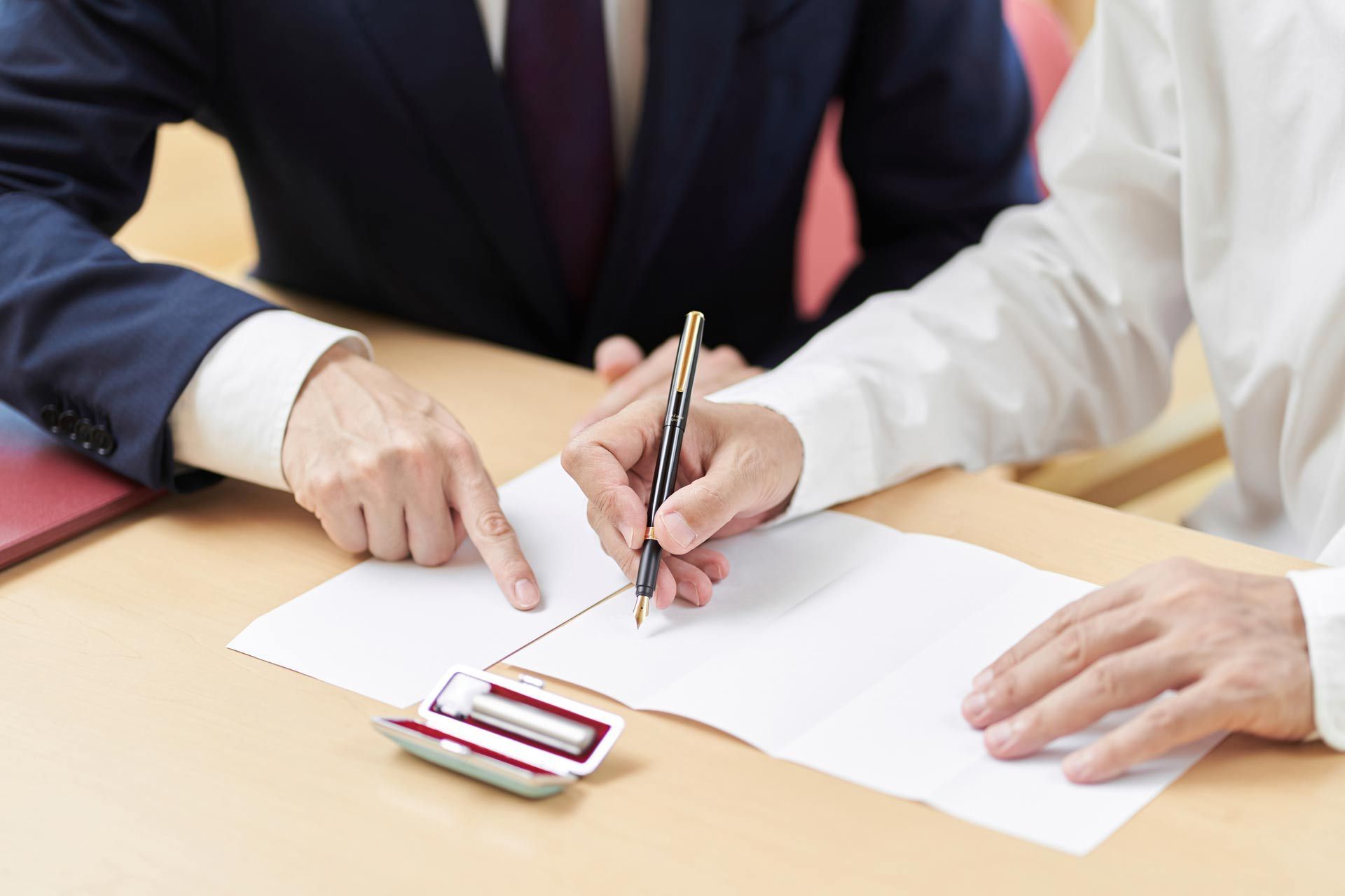 Hands of elderly people who consult with the profession about inheritance and wills