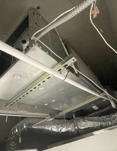 A ceiling with a lot of wires hanging from it