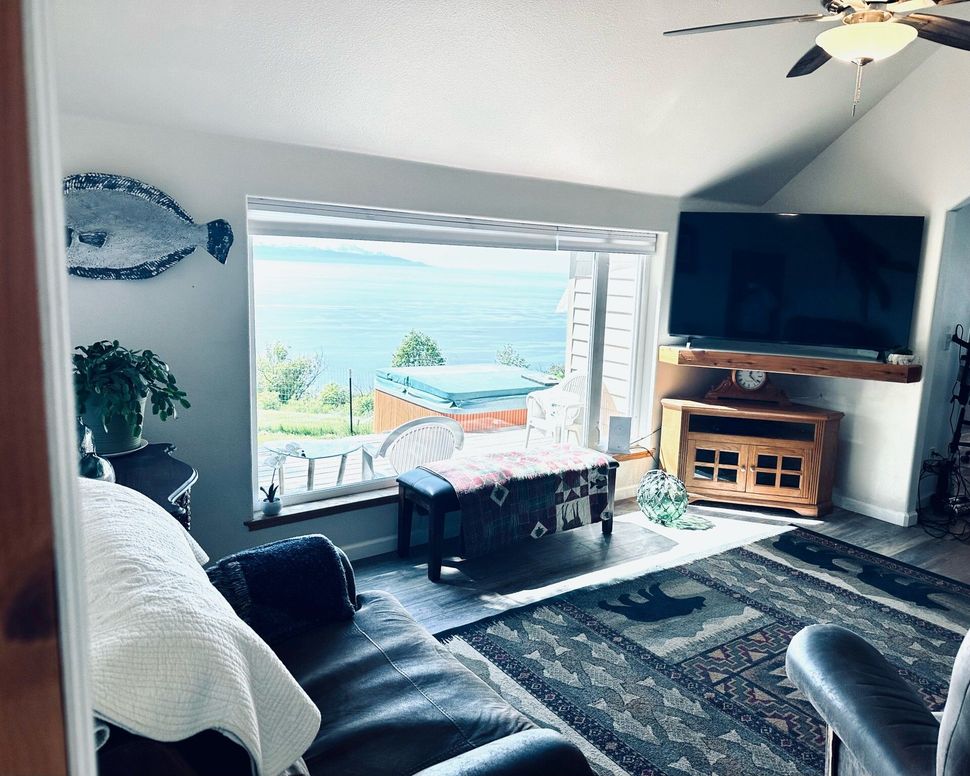 A living room with a couch and a flat screen tv