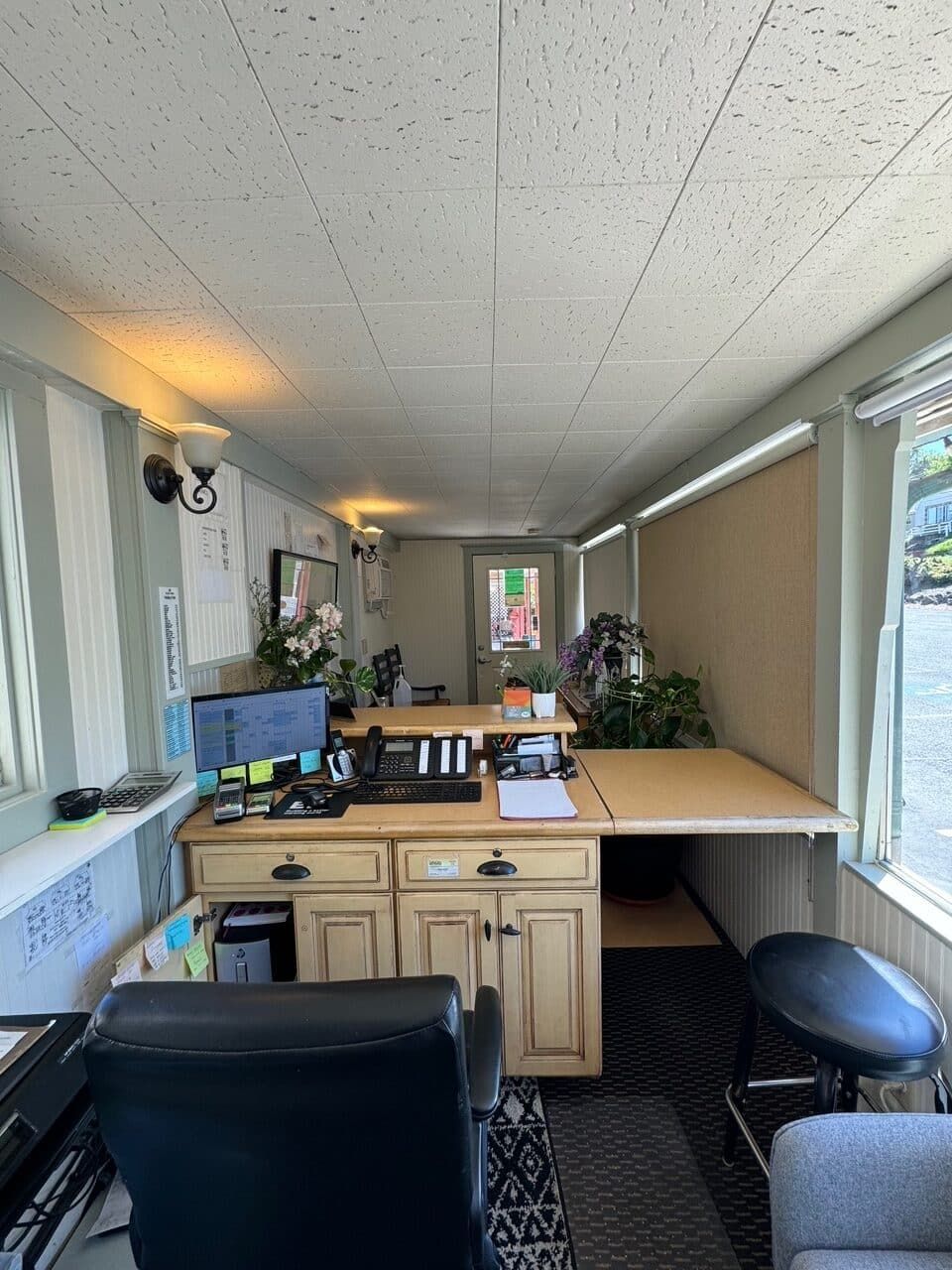 A room with a desk and a chair in it