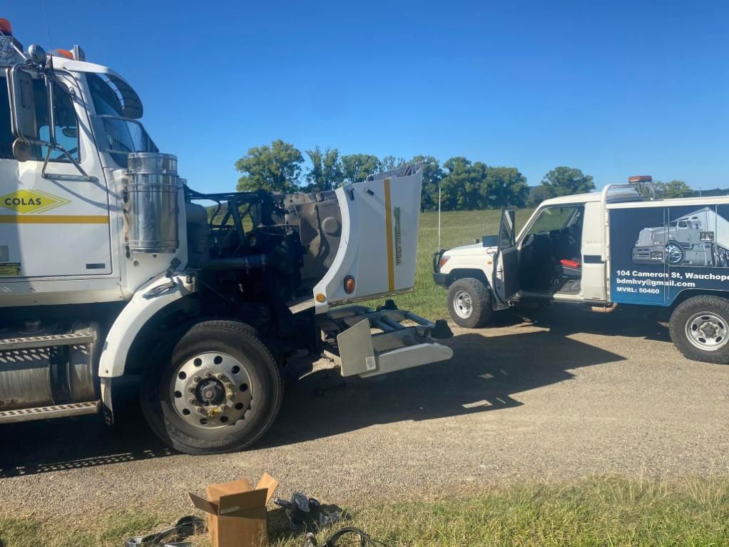 A Truck is Being Towed by a Tow Truck — BDM Heavy Vehicle Repairs In Wauchope, NSW